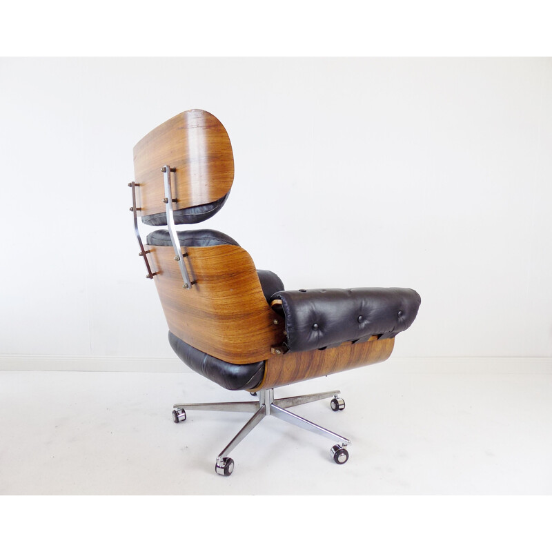 Vintage black leather armchair by Martin Stoll 1960