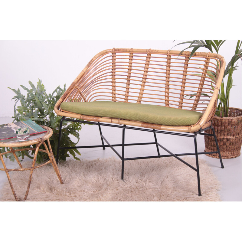 Vintage rattan sofa with lime green cushion 1960s