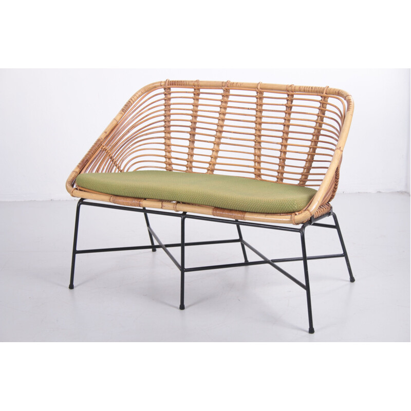 Vintage rattan sofa with lime green cushion 1960s