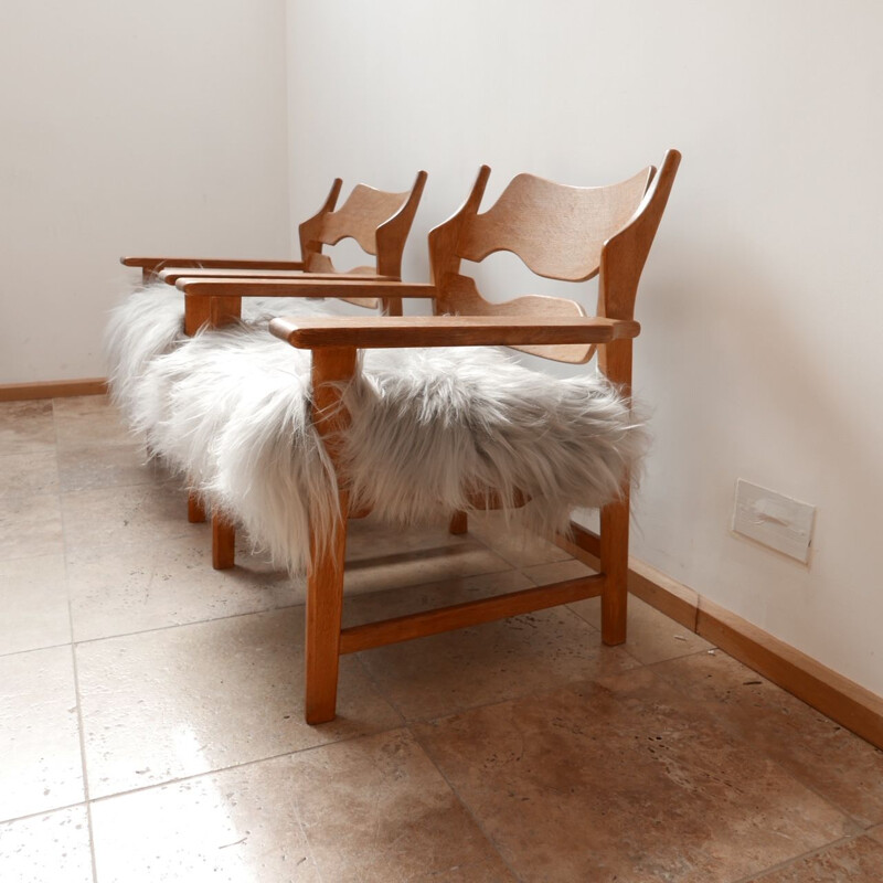 Pair of vintage oak sheepskin armchairs by Henning Kjaernul Denmark