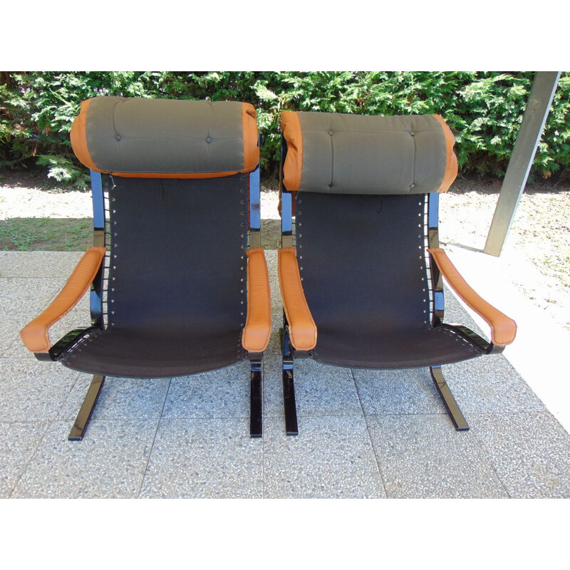 Pair of vintage leather and lacquered wood armchairs by Ingmar Relling