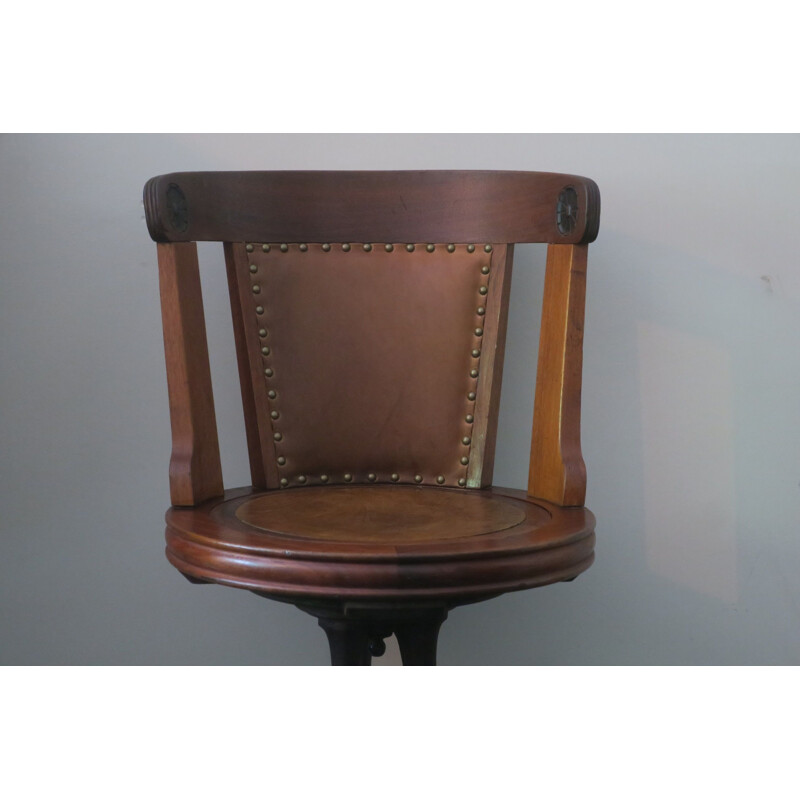 Vintage nautical teak and leather swivel chair on iron base