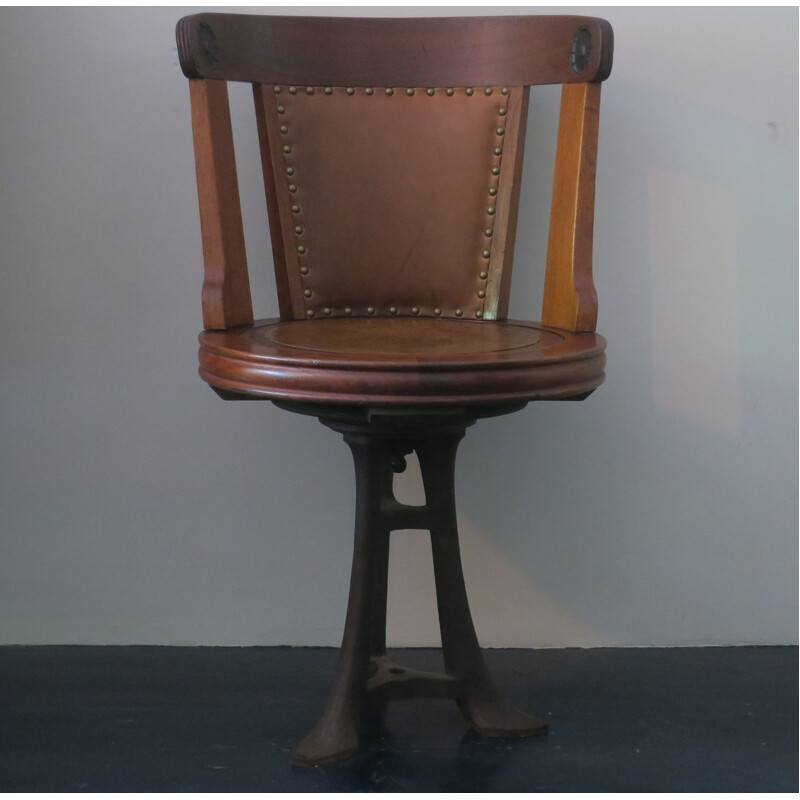 Vintage nautical teak and leather swivel chair on iron base