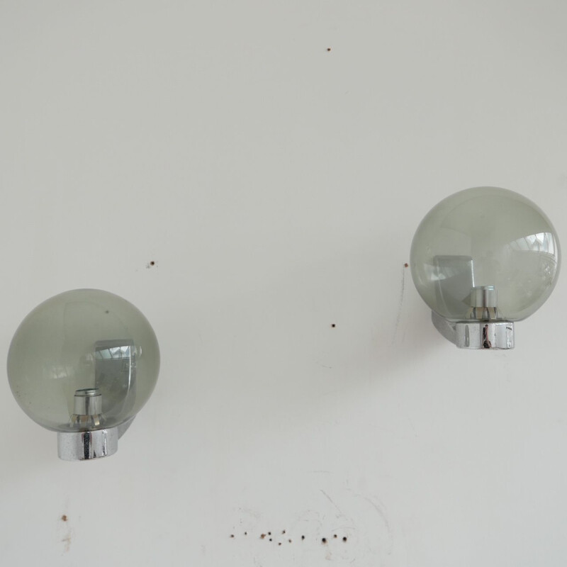 Paar vintage wandlampen van glas en chroom Holland 1970