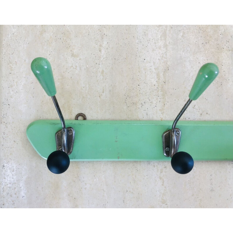 Vintage wall coat rack with 4 almond green wooden hooks 1950s