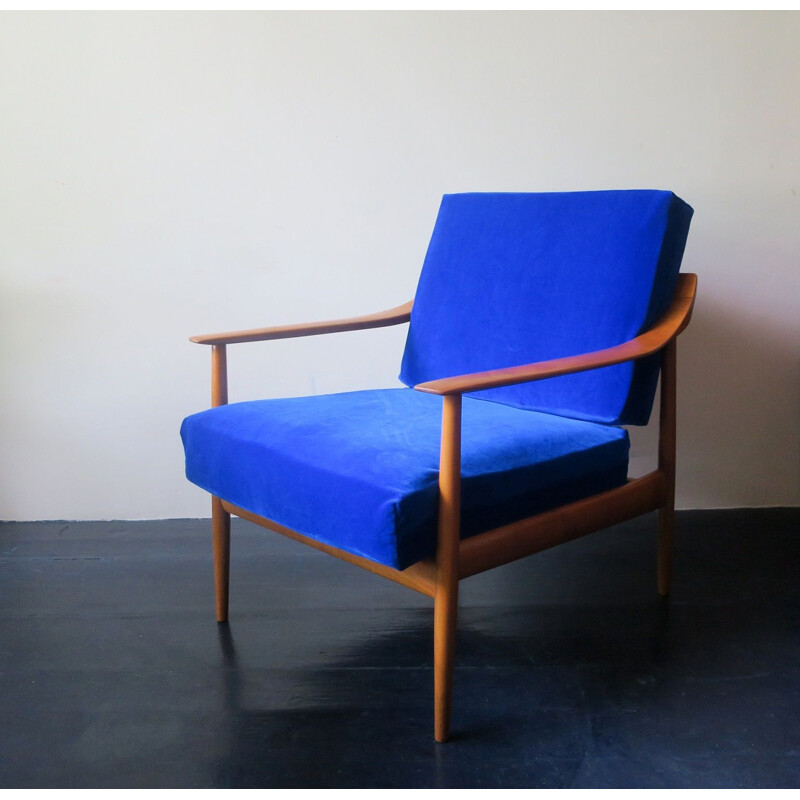 Vintage blue velvet lounge chair with curved back and sprung cushions 1960s