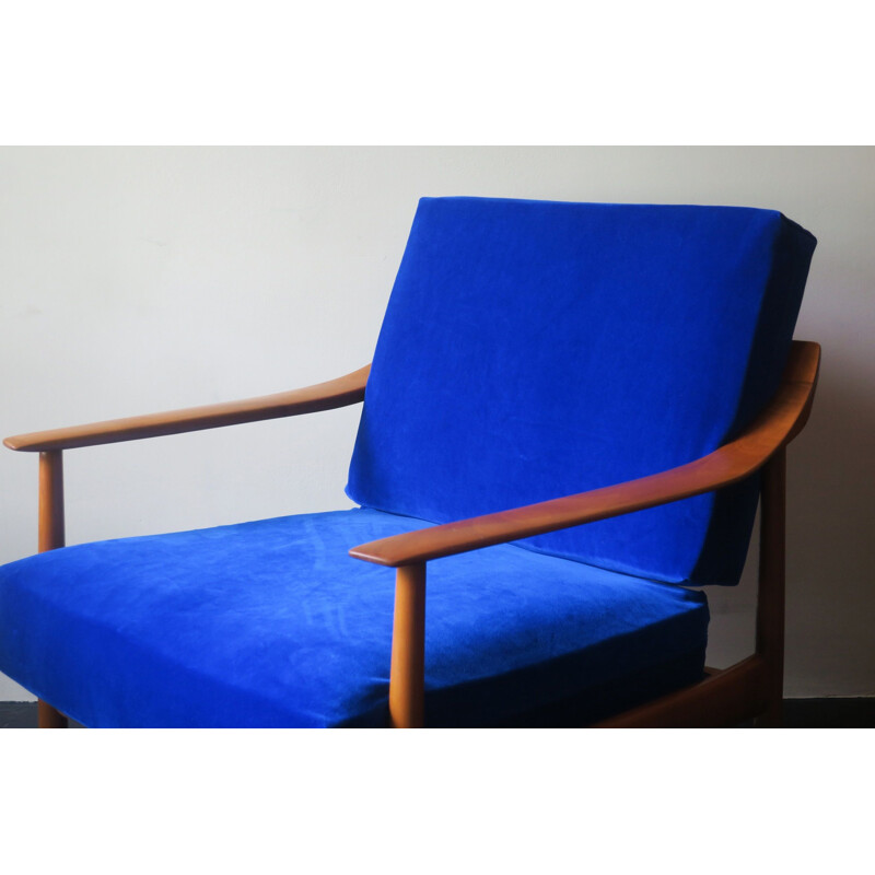 Vintage blue velvet lounge chair with curved back and sprung cushions 1960s