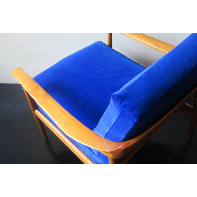 Vintage blue velvet lounge chair with curved back and sprung cushions 1960s