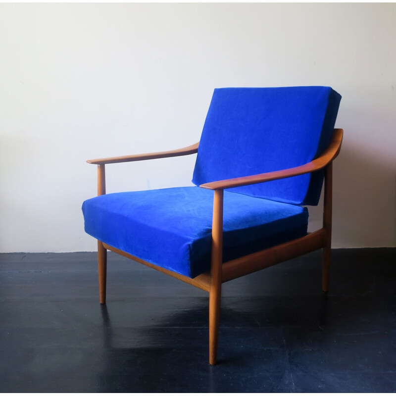 Vintage blue velvet lounge chair with curved back and sprung cushions 1960s
