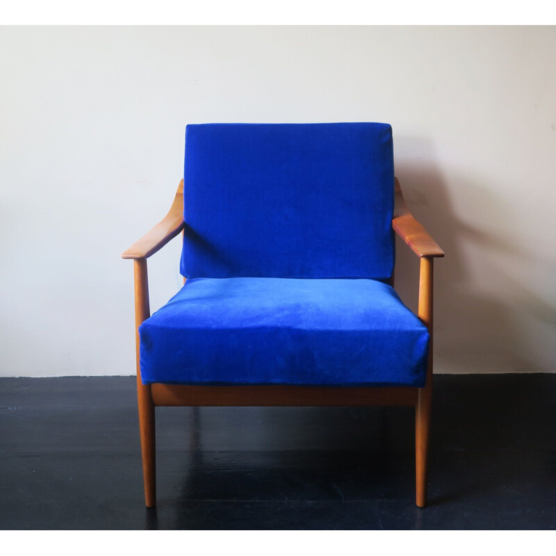 Vintage blue velvet lounge chair with curved back and sprung cushions 1960s