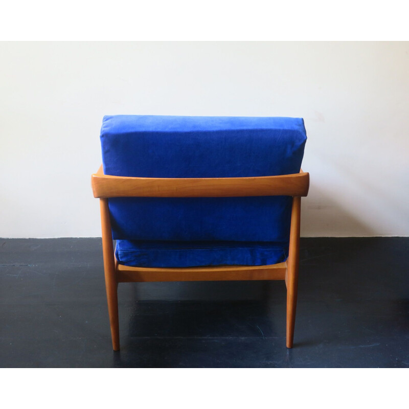 Vintage blue velvet lounge chair with curved back and sprung cushions 1960s