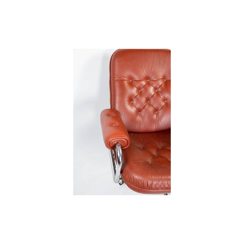 Mid century armchair upholstered with red leather and frame of metal, danish 1960s