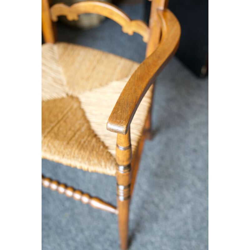 Vintage solid oak chair with ladder back and rush seat, England 1920