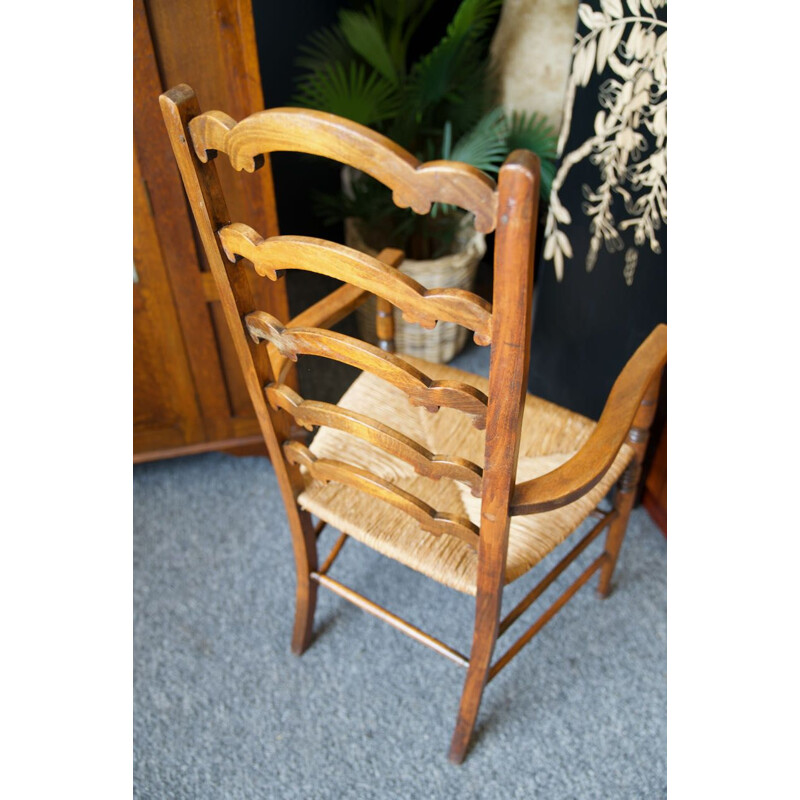 Vintage solid oak chair with ladder back and rush seat, England 1920