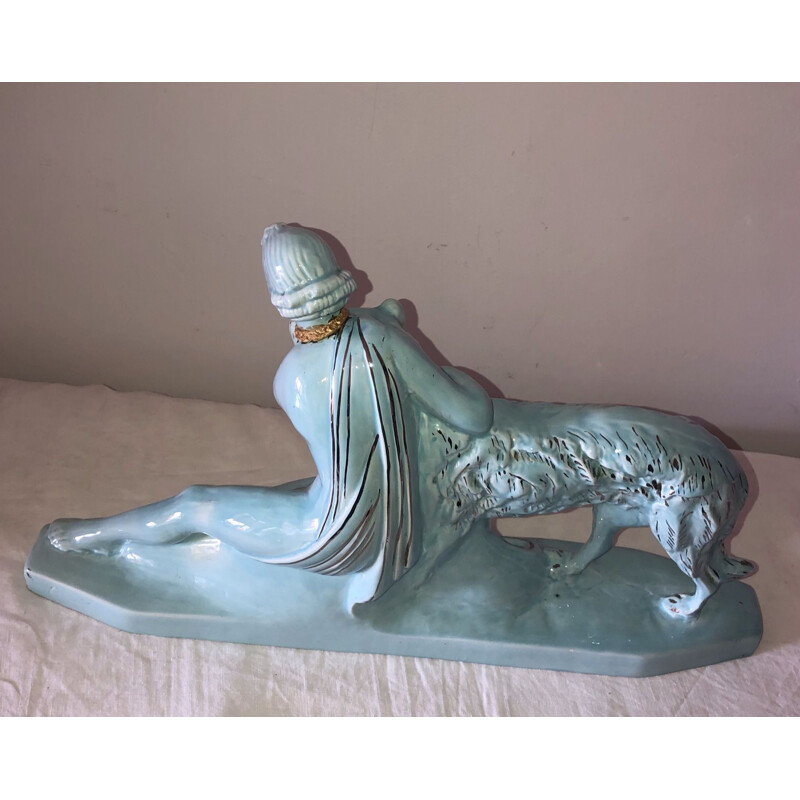 Mid century statue of a woman and a greyhound in glazed earthenware from the Art Deco, 1930s