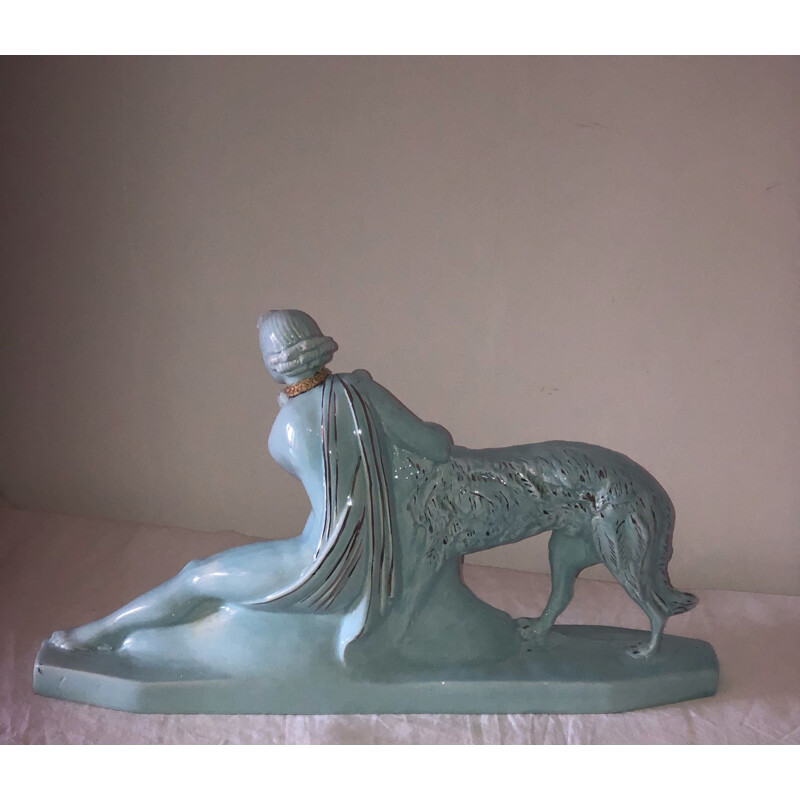 Mid century statue of a woman and a greyhound in glazed earthenware from the Art Deco, 1930s