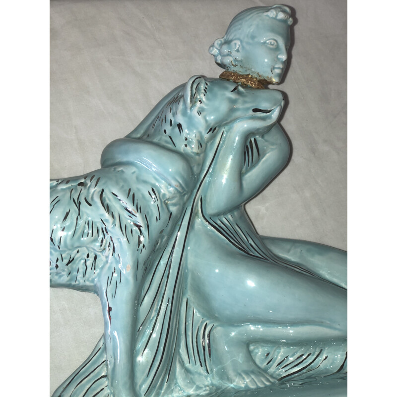 Mid century statue of a woman and a greyhound in glazed earthenware from the Art Deco, 1930s