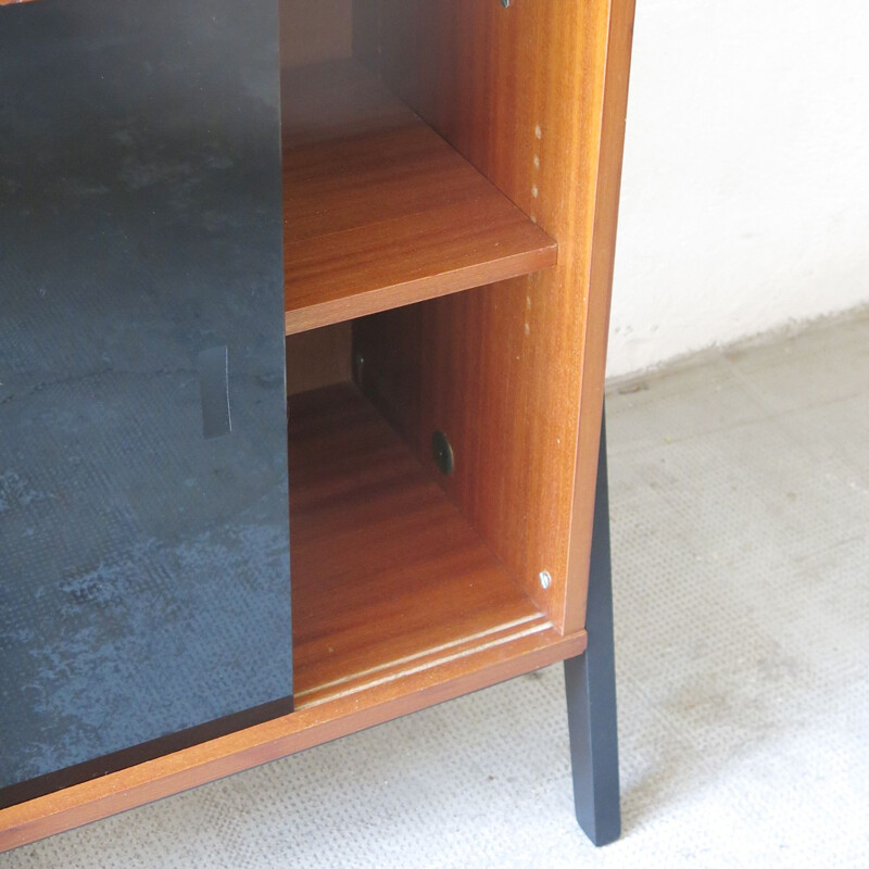 Mid century modernist sideboard with sliding panels in black and white tinted glass, 1960s