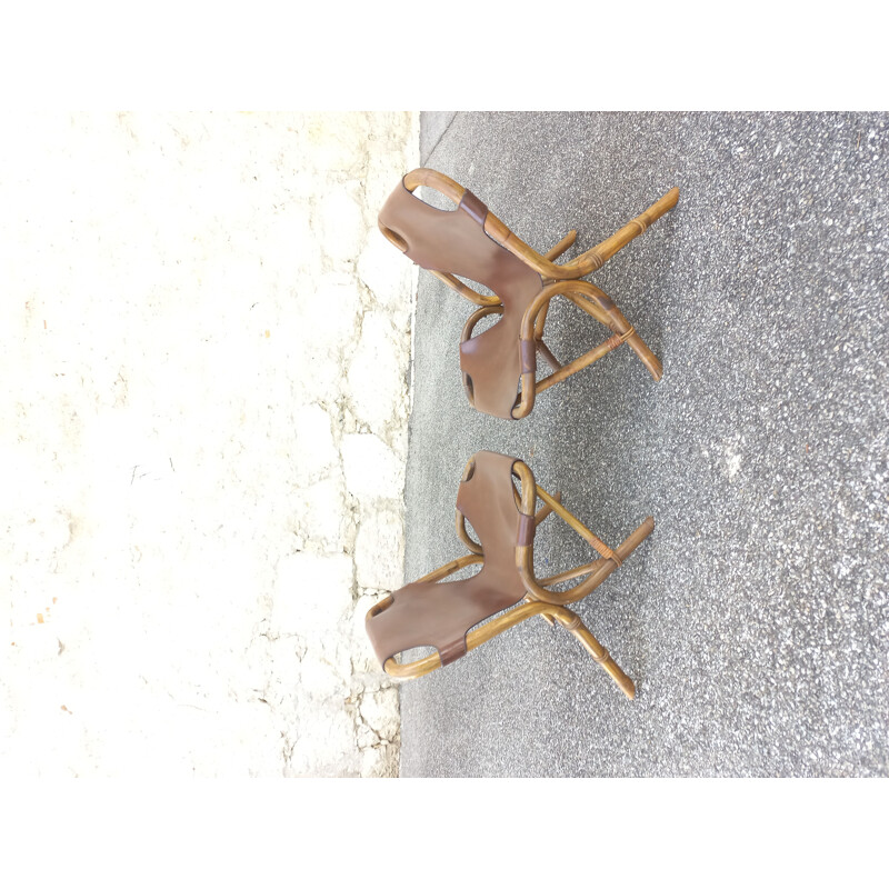 Pair of vintage armchairs in rattan and imitation leather