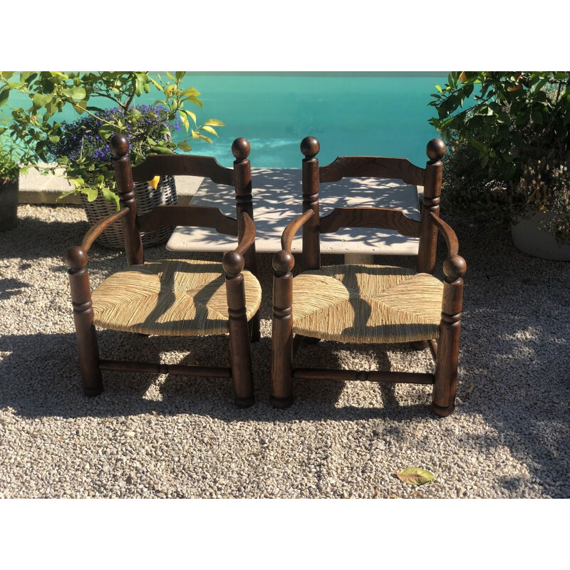 Pair of vintage oak and straw armchairs by Charles Dudouyt,1940s