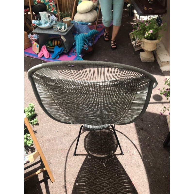 Mid-century woven armchair with steel legs