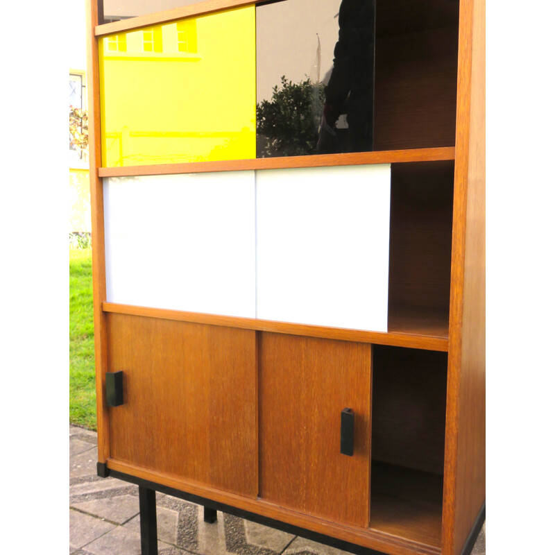 Modernist vintage teak bookcase with three-coloured sliding doors, France 1950