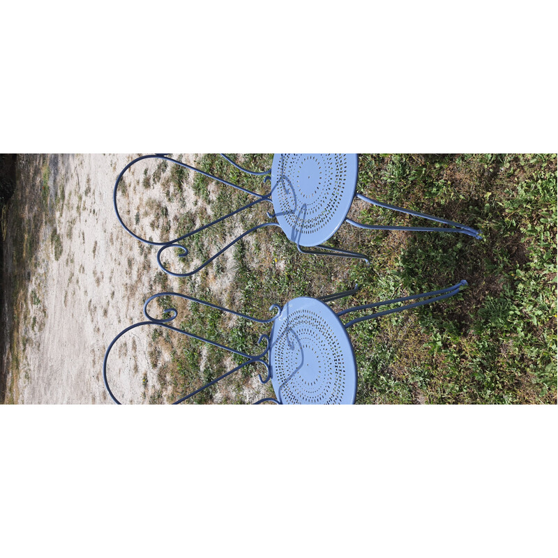 Vintage garden furniture table, armchairs and chairs in wrought iron blue colour