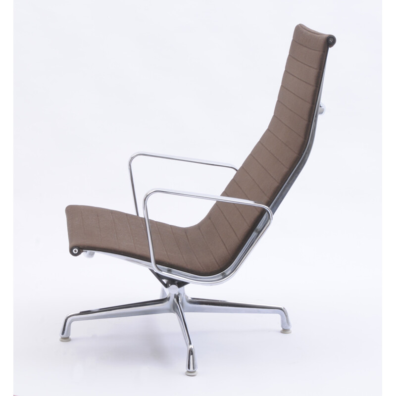 Vintage EA 124 swivel lounge chair by Charles and Ray Eames for Vitra