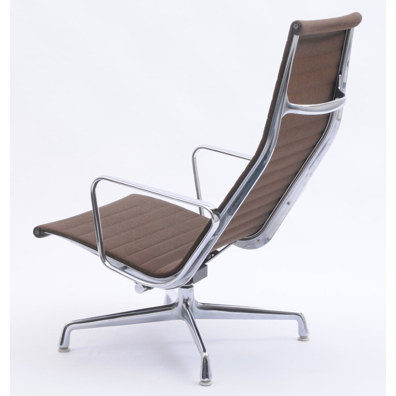 Vintage EA 124 swivel lounge chair by Charles and Ray Eames for Vitra