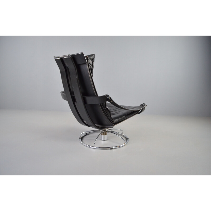 Vintage swivel armchair in black leather by Ake Fribytter for Nelo Möbel