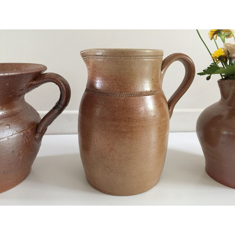 Set of 3 vintage enameled stoneware pitchers