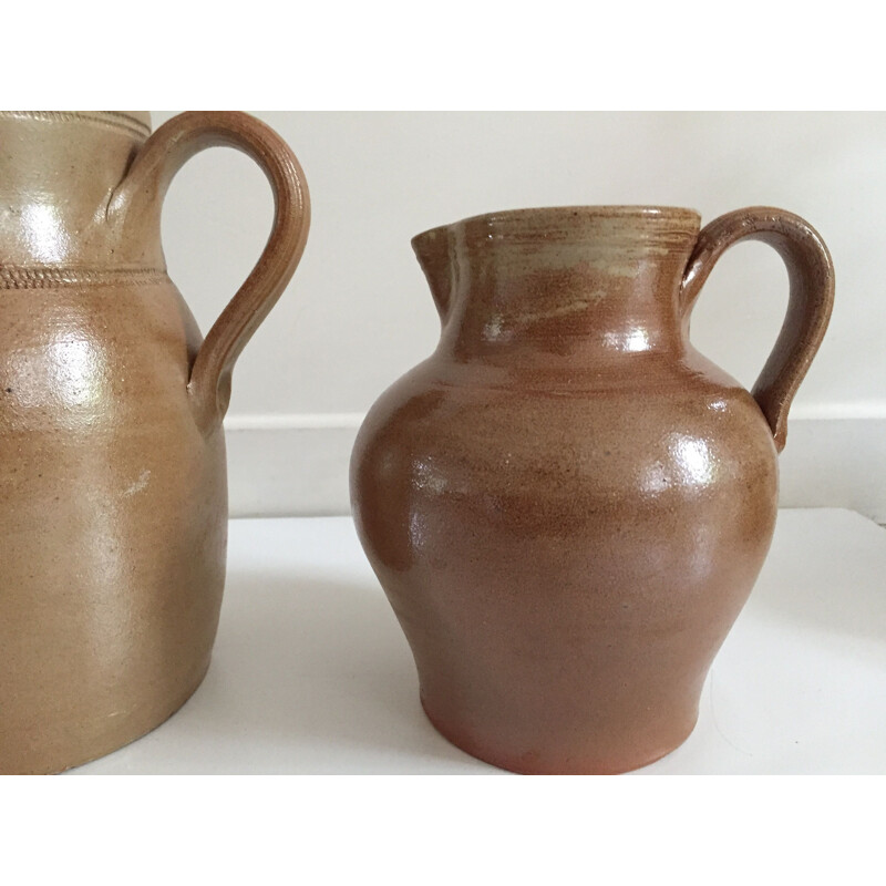 Set of 3 vintage enameled stoneware pitchers