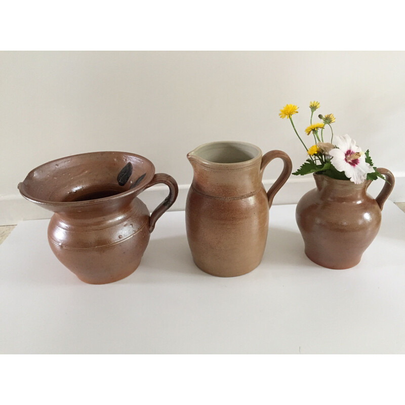 Set of 3 vintage enameled stoneware pitchers