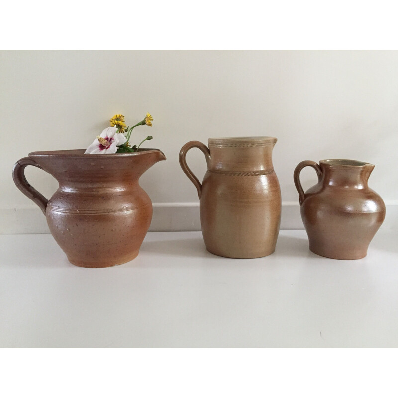 Set of 3 vintage enameled stoneware pitchers