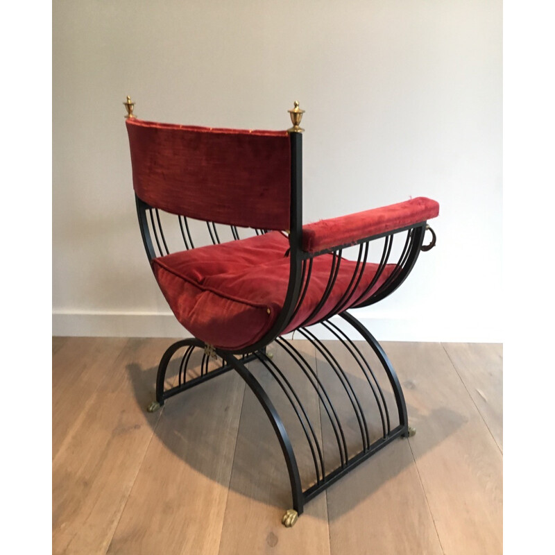 Red curule armchair in black iron and brass - 1970s