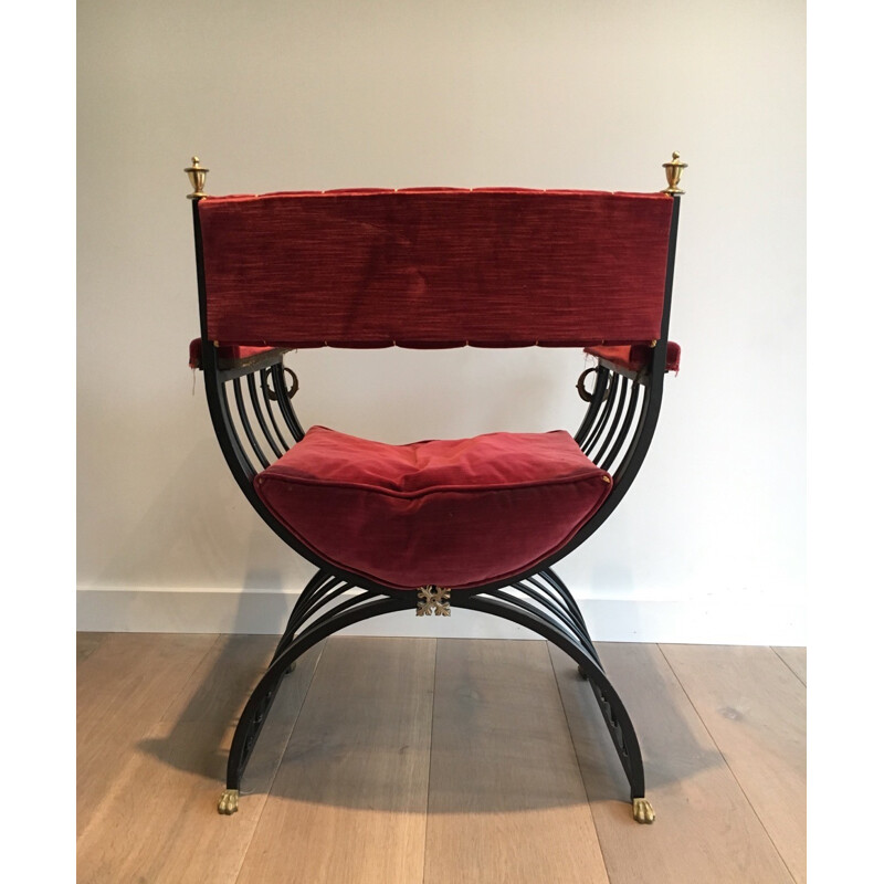 Red curule armchair in black iron and brass - 1970s