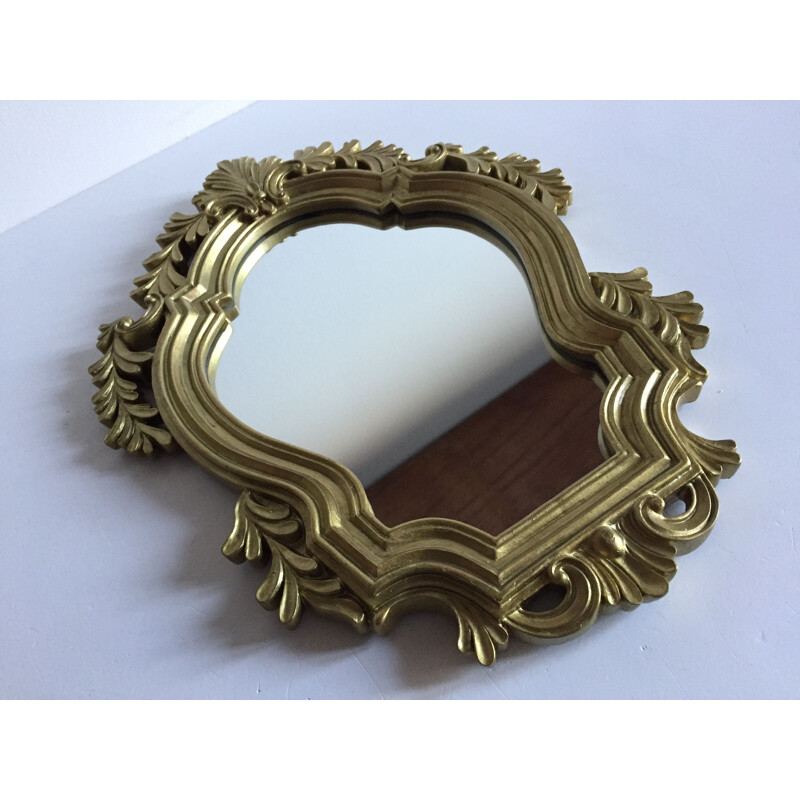 Vintage mirror in golden resin