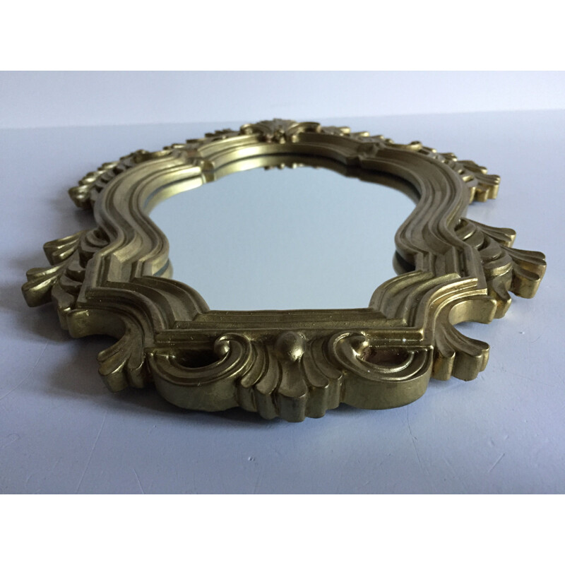 Vintage mirror in golden resin