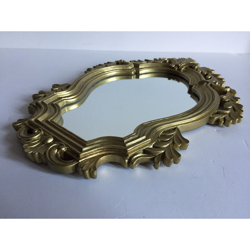 Vintage mirror in golden resin