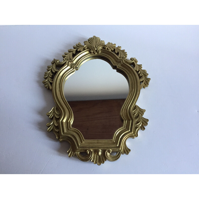 Vintage mirror in golden resin