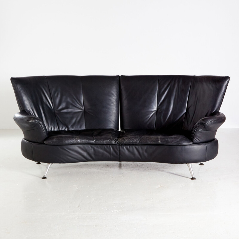 Two-seater black vintage leather sofa