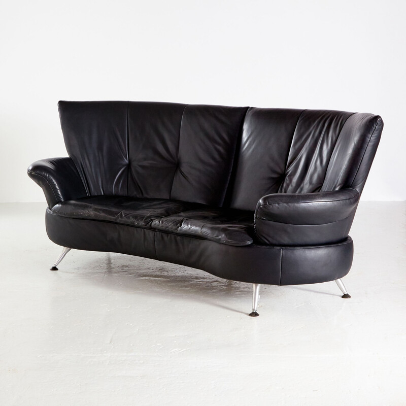 Two-seater black vintage leather sofa