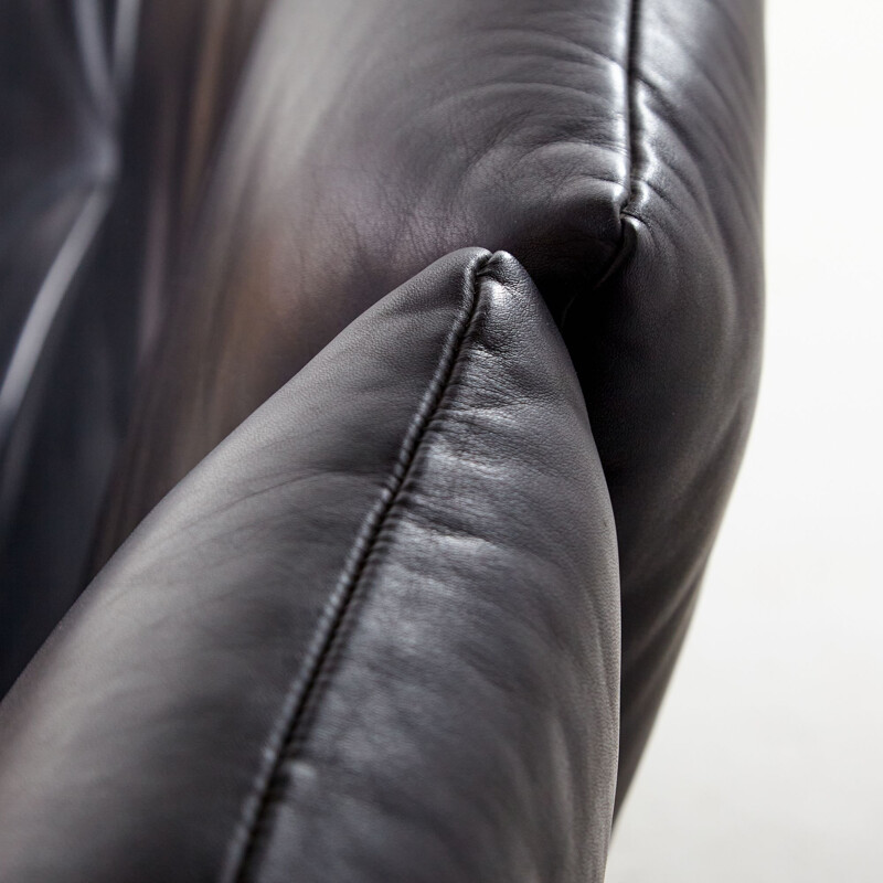 Two-seater black vintage leather sofa