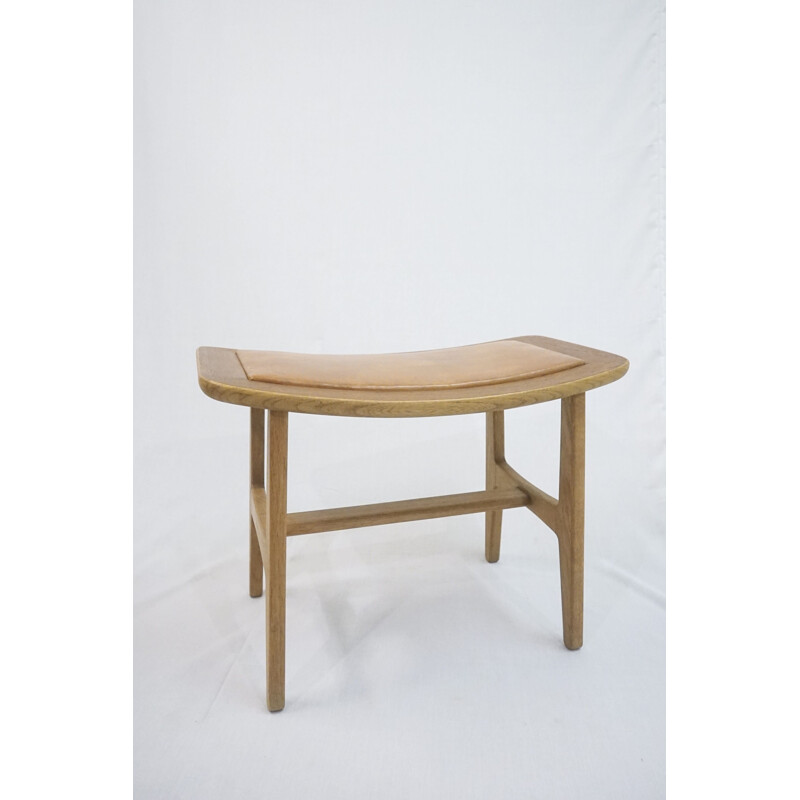 Vintage footstool in teak and oakwood with patinated brown leather by Peter Hvidt & Orla Mølgaard-Nielsen