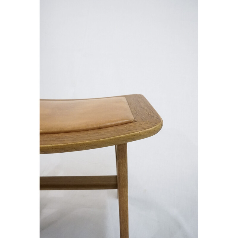 Vintage footstool in teak and oakwood with patinated brown leather by Peter Hvidt & Orla Mølgaard-Nielsen