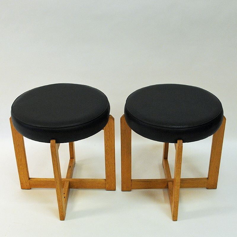 Pair of vintage oakwood and black leatherette stools, Sweden 1960