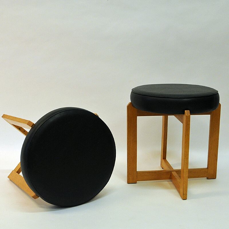 Pair of vintage oakwood and black leatherette stools, Sweden 1960