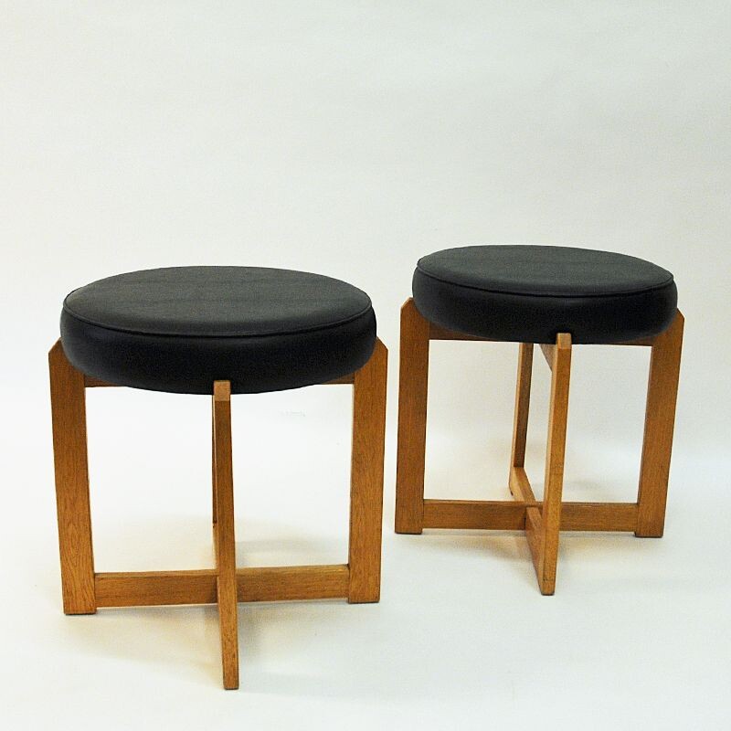 Pair of vintage oakwood and black leatherette stools, Sweden 1960