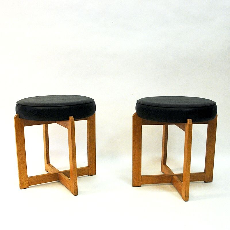 Pair of vintage oakwood and black leatherette stools, Sweden 1960