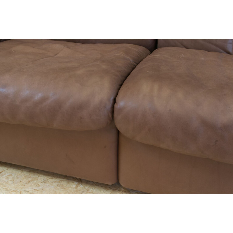 Set of vintage brown leather sofa and ottoman by De Sede